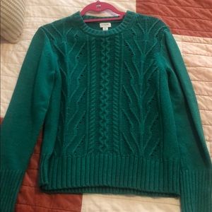 Green crew neck sweater.